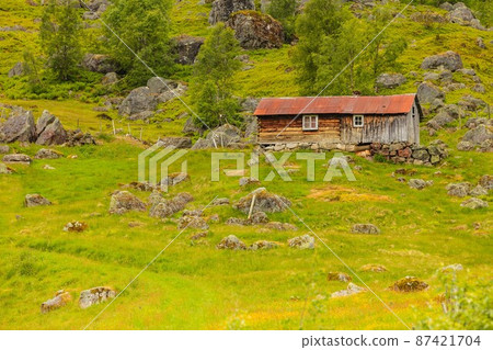 Old wooden cabin in forest Norway 87421704