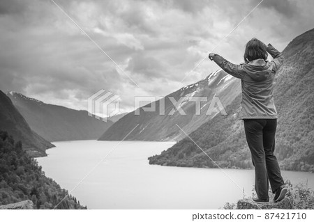 Woman tourist in norwegian mountains fjords 87421710