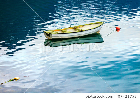 Little boat on water surface Little boat on water surface 87421755