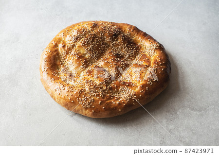 Close up of Ramadan pide on a gray background. Close up of Ramadan pide on a gray background. 87423971