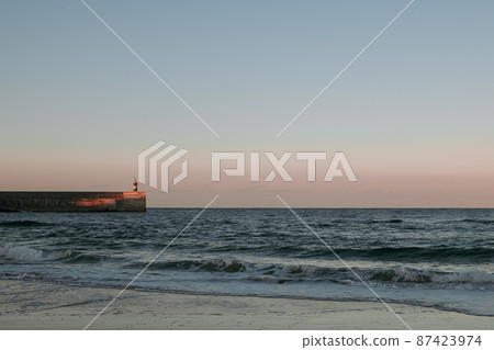 Beautiful view to the lighthouse at sunset, Cantabria, Spain. Beautiful view to the lighthouse at sunset, Cantabria, Spain. 87423974