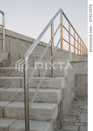 Outdoor urban stairs with metal handrails. Outdoor urban stairs with metal handrails. 87423976