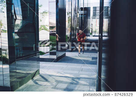 Active man running in city Active man running in city 87426329