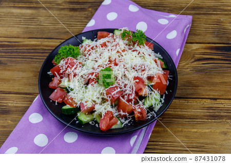 Traditional Bulgarian Shopska salad on wooden table Traditional Bulgarian Shopska salad on wooden table 87431078
