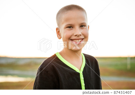 Happy little boy smiling. a guy of caucasian ethnicity Happy little boy smiling. a guy of caucasian ethnicity 87431407