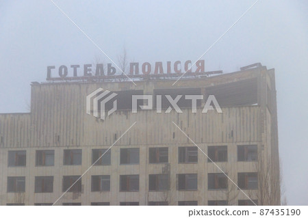 Abandoned building of Polissya hotel in the ghost town Pripyat in Chernobyl Exclusion Zone, Ukraine. Inscription in Ukrainian 87435190