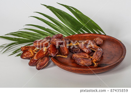 Dried dates (fruit of Phoenix dactylifera dates). Clipping paths for both the object and the shadow. Infinite depth of field, retouched. Set, bundle, Dried dates (fruit of Phoenix dactylifera dates). Clipping paths for both the object and the shadow. Infinite depth of field, retouched. Set, bundle, 87435859