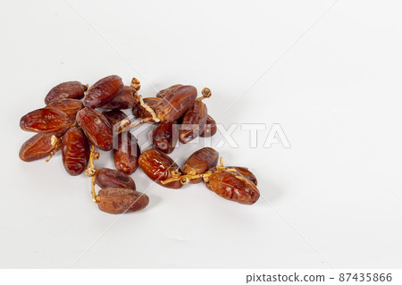 Dried dates (fruit of Phoenix dactylifera dates). Clipping paths for both the object and the shadow. Infinite depth of field, retouched. Set, bundle, 87435866