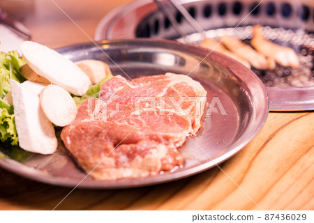 Korean traditional style fresh pork beef belly BBQ on stove serve wood table 87436029