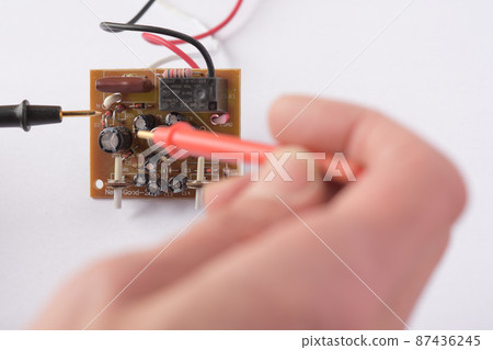 Electronic board repair, inspected with a tester Electronic board repair, inspected with a tester 87436245