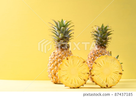 Fresh pineapple fruit on yellow background, Tropical fruit 87437185