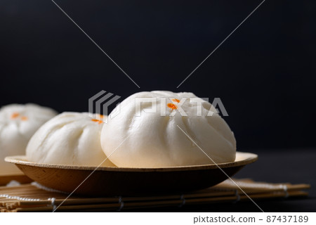Steamed Chinese bun stuffed with minced pork, egg yolk or sweet  87437189