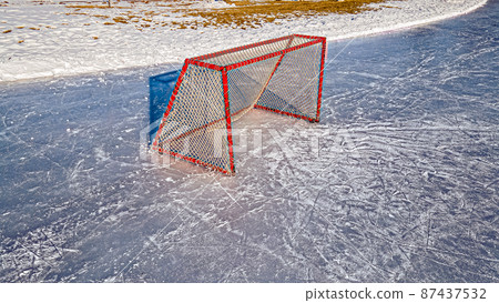 Early morning day at hockey rink 87437532