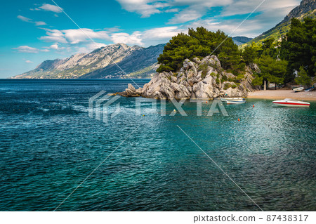 Moored motorboats in the amazing bay in Brela, Dalmatia, Croatia Moored motorboats in the amazing bay in Brela, Dalmatia, Croatia 87438317