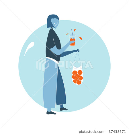 woman drink orange juice from glass with a straw woman drink orange juice from glass with a straw 87438571