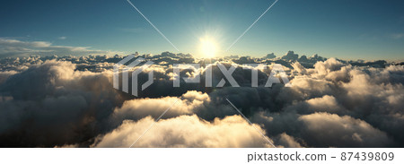 Aerial view of clouds and morning sun Aerial view of clouds and morning sun 87439809