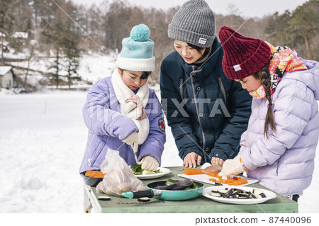 Camping children cooking food Camping children cooking food 87440096