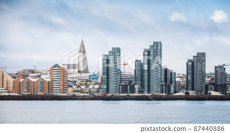 Reykjavik with modern houses and Hallgrimskirkja cathedral 87440886