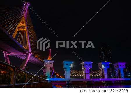 Bhumibol Bridge also casually call as Industrial Ring Road Bridge with floodgate illuminate with spotlight at night scene, Samut Prakarn, Thailand Bhumibol Bridge also casually call as Industrial Ring Road Bridge with floodgate illuminate with spotlight at night scene, Samut Prakarn, Thailand 87442999