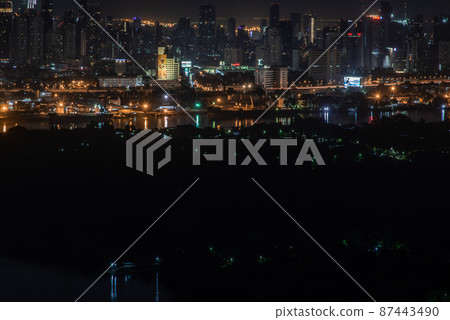 Beautiful view of Bangkok city, Beauty skyscrapers along Chaopraya river in the night, making the city modern style. 87443490