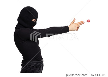 Portrait of young anonymous person wearing black outfit and balaclava isolated on white background. Concept of art, fashion, anti-terrorizm Portrait of young anonymous person wearing black outfit and balaclava isolated on white background. Concept of art, fashion, anti-terrorizm 87444106