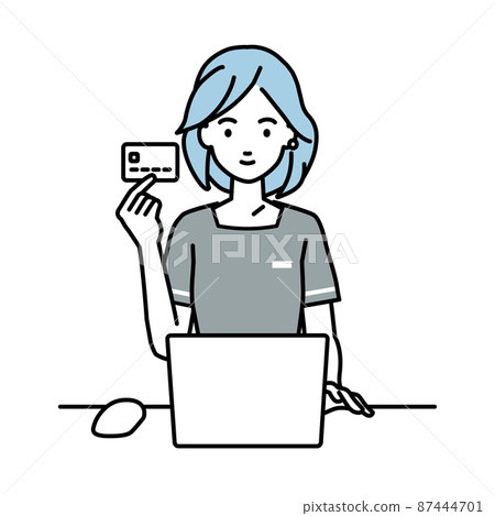 Esthetician clerk / receptionist woman sitting at a desk and using a PC while holding a credit card 87444701