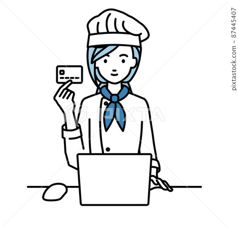 A cook woman sitting at a desk and using a PC while holding a credit card A cook woman sitting at a desk and using a PC while holding a credit card 87445407