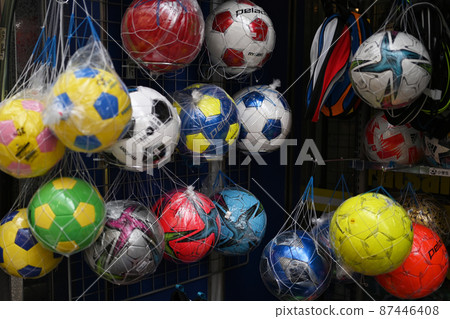 Image of the storefront of a colorful soccer ball sporting goods store 87446408