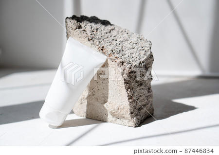 Clean white cream tube with trendy shadows and stone texture Clean white cream tube with trendy shadows and stone texture 87446834