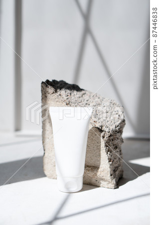 Clean white cream tube with trendy shadows and stone texture Clean white cream tube with trendy shadows and stone texture 87446838