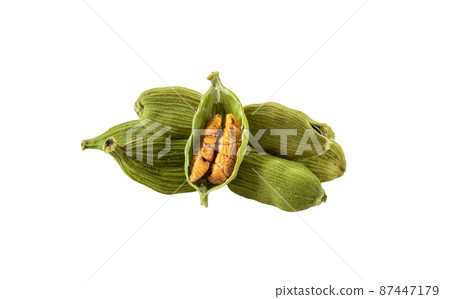 Green cardamom pods with seeds isolated on white background with copy space for text or images. Spices, food, cooking concept. Close-up shot. 87447179