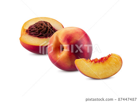Smooth-skinned whole nectarine, one half with kernel and one unpitted slice isolated on white background with copy space for text, images. Close-up. Smooth-skinned whole nectarine, one half with kernel and one unpitted slice isolated on white background with copy space for text, images. Close-up. 87447487