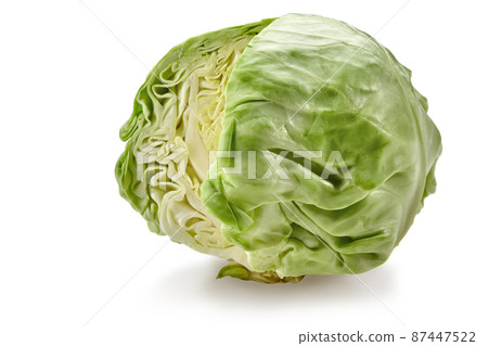 Fresh harvested, pale green cabbage without one cut off part. Isolated on white background. Smooth-leafed vegetable. Close up, copy space 87447522