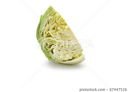 One cut off piece of light green cabbage isolated on white background. Smooth-leafed vegetable, summer harvest. Close up, copy space 87447526