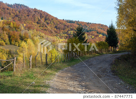 Autumn Carpathian Mountains and dirty countryside path, Ukraine. Autumn Carpathian Mountains and dirty countryside path, Ukraine. 87447771