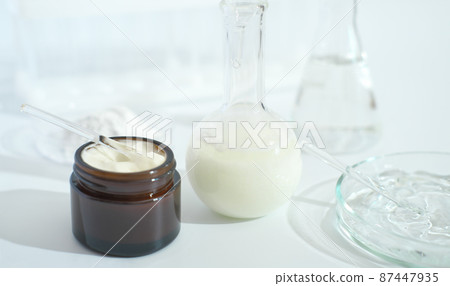 fermented cosmetic in a laboratory. enzymatic fermentation process, skin regeneration with amino acids, petri dishes with ingredients. 87447935