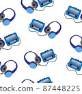 Portable cassette audio player and headphones on a white background. 87448225