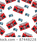 An analog portable tape recorder and audio cassette on a white background. 87448228
