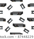 An analog VCR and videotape on a white background. 87448229