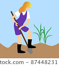 Woman digging a bed in the garden plot. 87448231