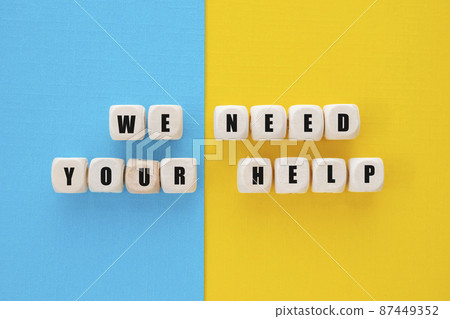 We need your help words written on wooden blocks, abstract We need your help words written on wooden blocks, abstract 87449352