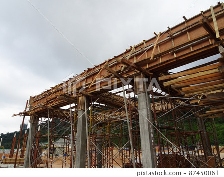 KUALA LUMPUR, MALAYSIA - JULY 7, 2021: Beam and column formwork installed at a construction site. Molds are made of wood and plywood. Be the basis of form to reinforced concrete. 87450061