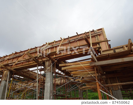 KUALA LUMPUR, MALAYSIA - JULY 7, 2021: Beam and column formwork installed at a construction site. Molds are made of wood and plywood. Be the basis of form to reinforced concrete. 87450062