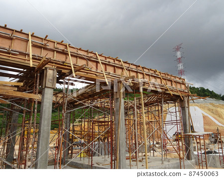 KUALA LUMPUR, MALAYSIA - JULY 7, 2021: Beam and column formwork installed at a construction site. Molds are made of wood and plywood. Be the basis of form to reinforced concrete. 87450063
