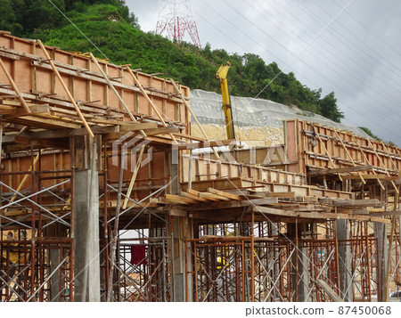KUALA LUMPUR, MALAYSIA - JULY 7, 2021: Beam and column formwork installed at a construction site. Molds are made of wood and plywood. Be the basis of form to reinforced concrete. 87450068