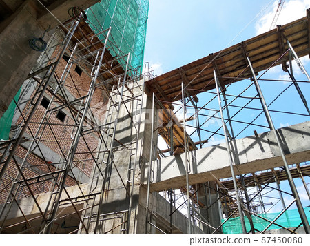 KUALA LUMPUR, MALAYSIA - JULY 7, 2021: Beam and column formwork installed at a construction site. Molds are made of wood and plywood. Be the basis of form to reinforced concrete. KUALA LUMPUR, MALAYSIA - JULY 7, 2021: Beam and column formwork installed at a construction site. Molds are made of wood and plywood. Be the basis of form to reinforced concrete. 87450080