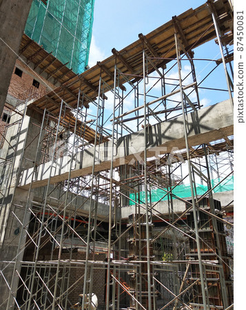 KUALA LUMPUR, MALAYSIA - JULY 7, 2021: Beam and column formwork installed at a construction site. Molds are made of wood and plywood. Be the basis of form to reinforced concrete. KUALA LUMPUR, MALAYSIA - JULY 7, 2021: Beam and column formwork installed at a construction site. Molds are made of wood and plywood. Be the basis of form to reinforced concrete. 87450081