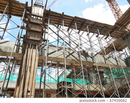 KUALA LUMPUR, MALAYSIA - JULY 7, 2021: Beam and column formwork installed at a construction site. Molds are made of wood and plywood. Be the basis of form to reinforced concrete. KUALA LUMPUR, MALAYSIA - JULY 7, 2021: Beam and column formwork installed at a construction site. Molds are made of wood and plywood. Be the basis of form to reinforced concrete. 87450082