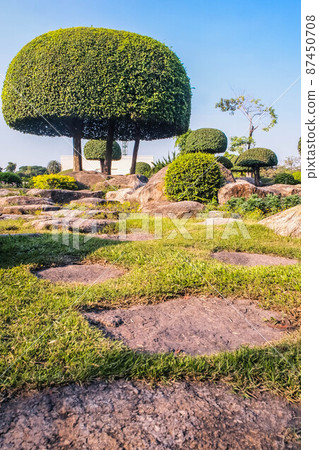 Picturesque Japanese garden.Chinese japanese garden topiary dcoration design shrub form. Picturesque Japanese garden.Chinese japanese garden topiary dcoration design shrub form. 87450708