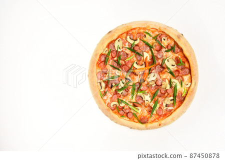Spicy pizza with chili peppers. Pizza with sausages and mushrooms Spicy pizza with chili peppers. Pizza with sausages and mushrooms 87450878